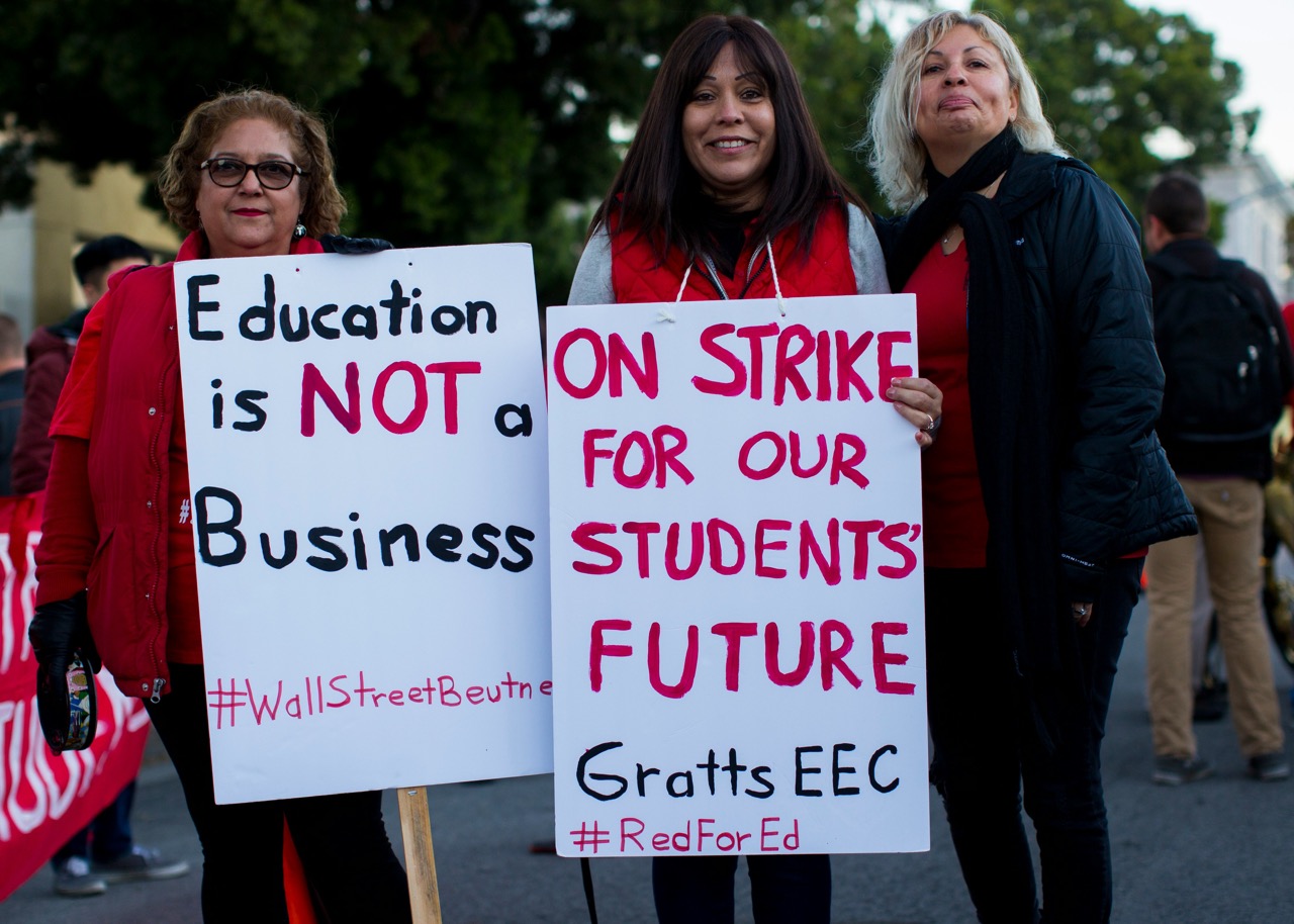 Image of 2 women holding protest signs, 