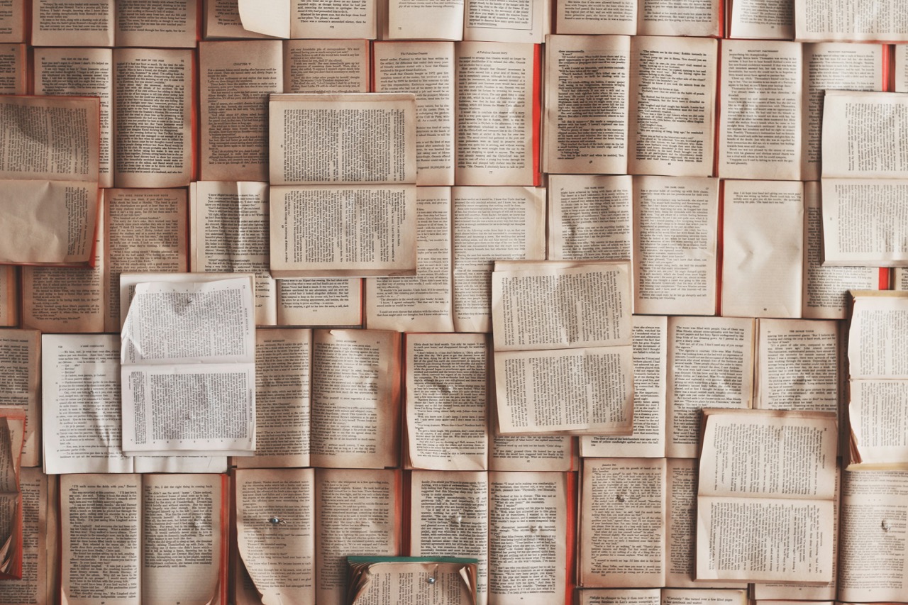 Image of open books layered on top of each other.